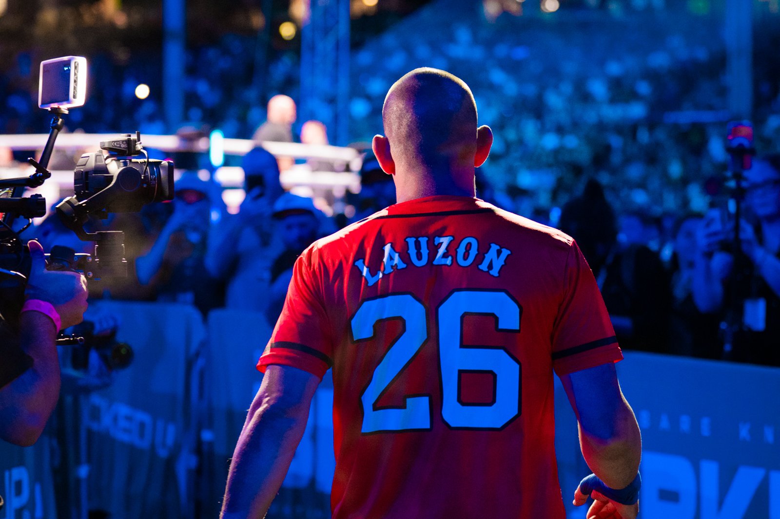 Joe Lauzon walks out at BKFC 92 at Fenway Park in his LAUZON 26 jersey